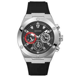 A Guess men's chronograph watch featuring a silver stainless steel case, a black dial with three sub-dials (including one with a red accent), and a black silicone strap, shown against a plain white background.