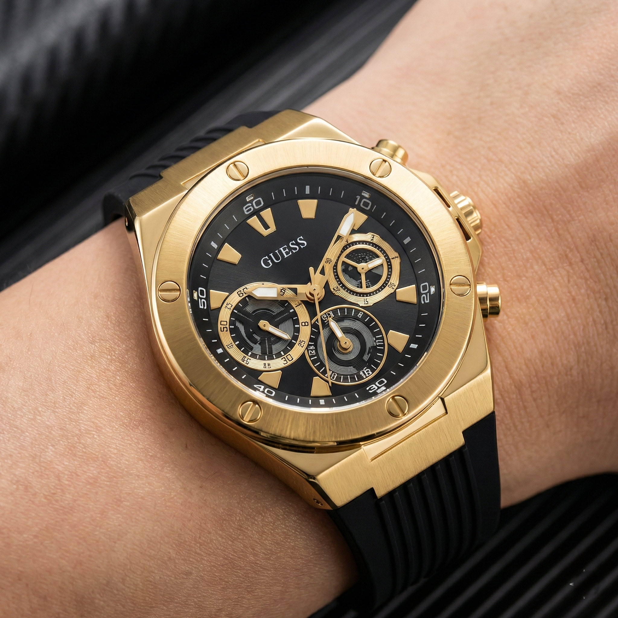 Detailed close-up of Guess GW0417G4 black dial and gold markers