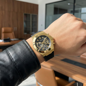 AI lifestyle shot of Guess GW0417G4 gold watch on a man's wrist