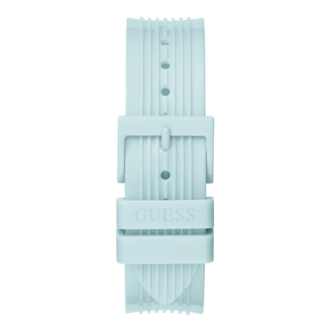 A light blue silicone watch strap with a matching buckle, featuring the GUESS brand name embossed on the center keeper, shown against a plain white background.