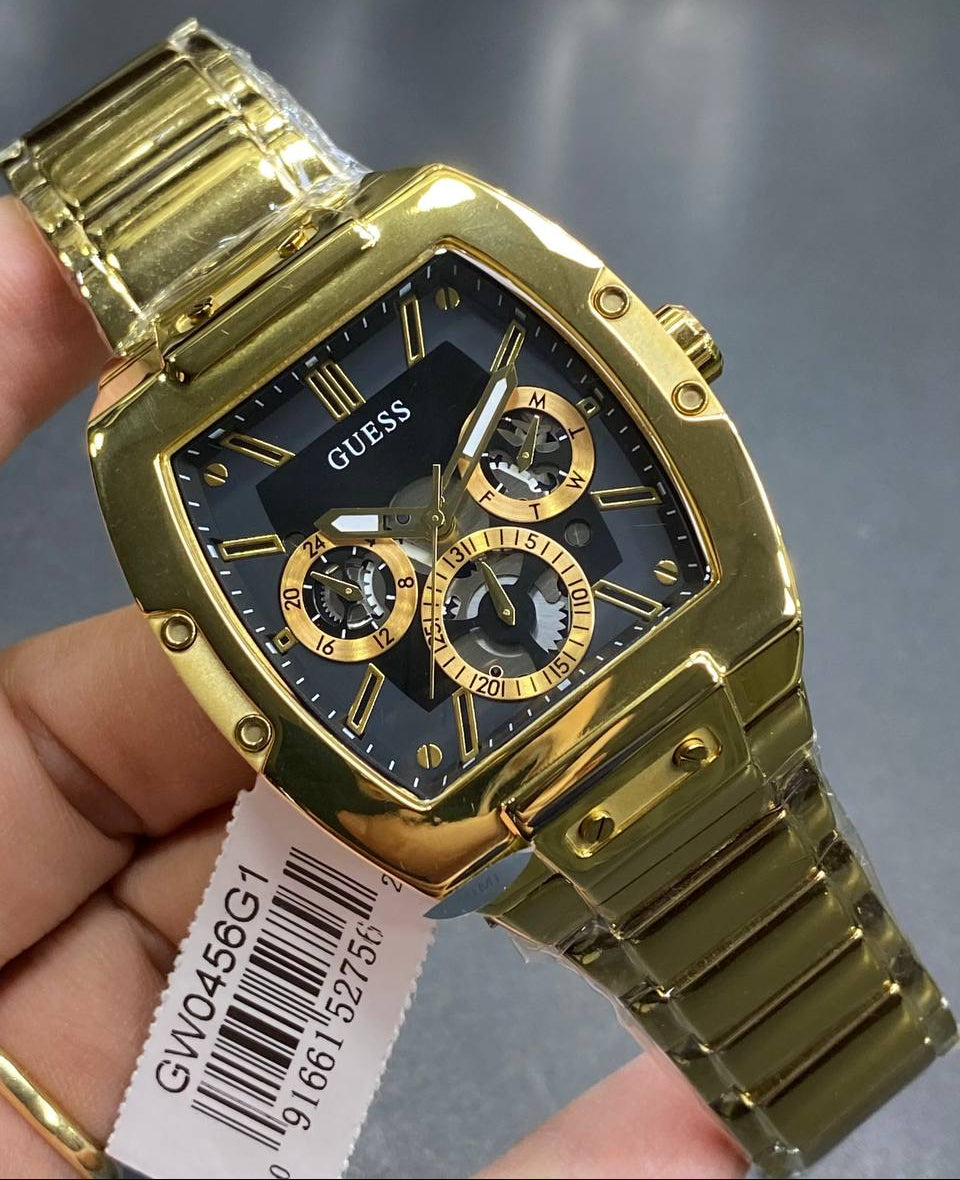 Real-life image of Guess GW0456G1 showing the actual black dial contrast and gold shine