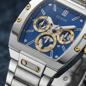 Detailed close-up of the blue skeleton dial and gold screws on Guess GW0456G5