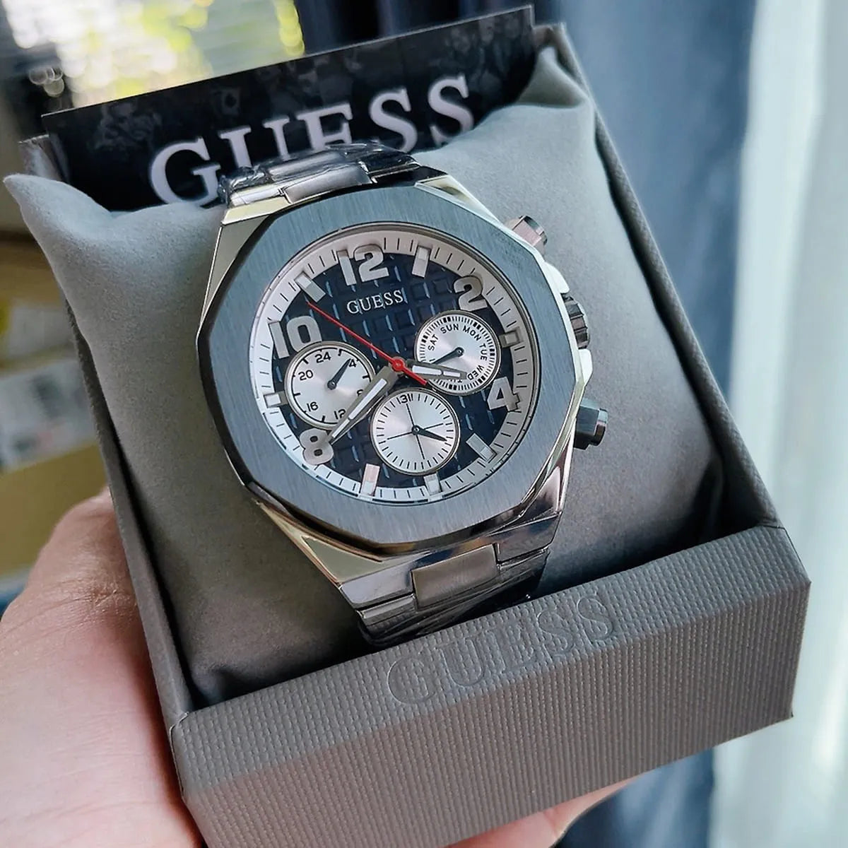 Silver-tone deployment clasp on the integrated steel bracelet of the Guess GW0489G1