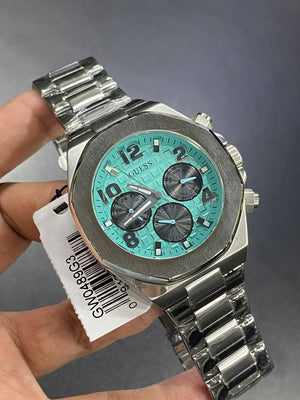 Authentic real-life photo of the Guess GW0489G3 showing actual silver shine and vibrant turquoise dial color in Egypt