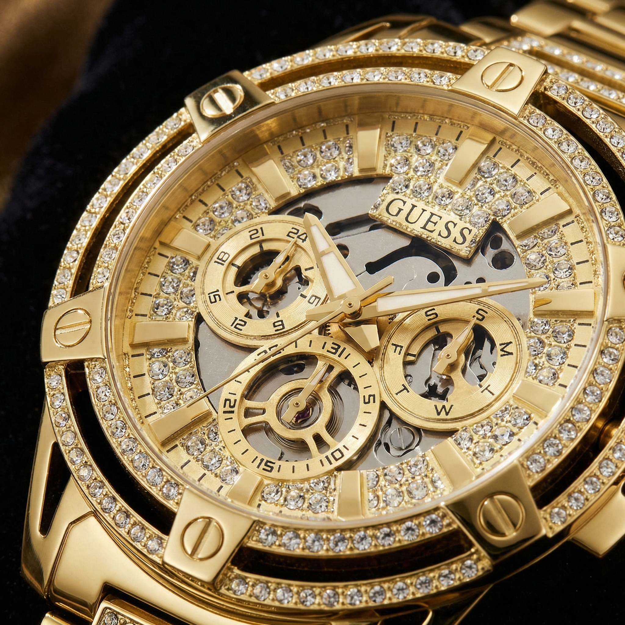Close up shot of Guess GW0497G2 watch on wrist showing the intense crystal sparkle and skeleton dial