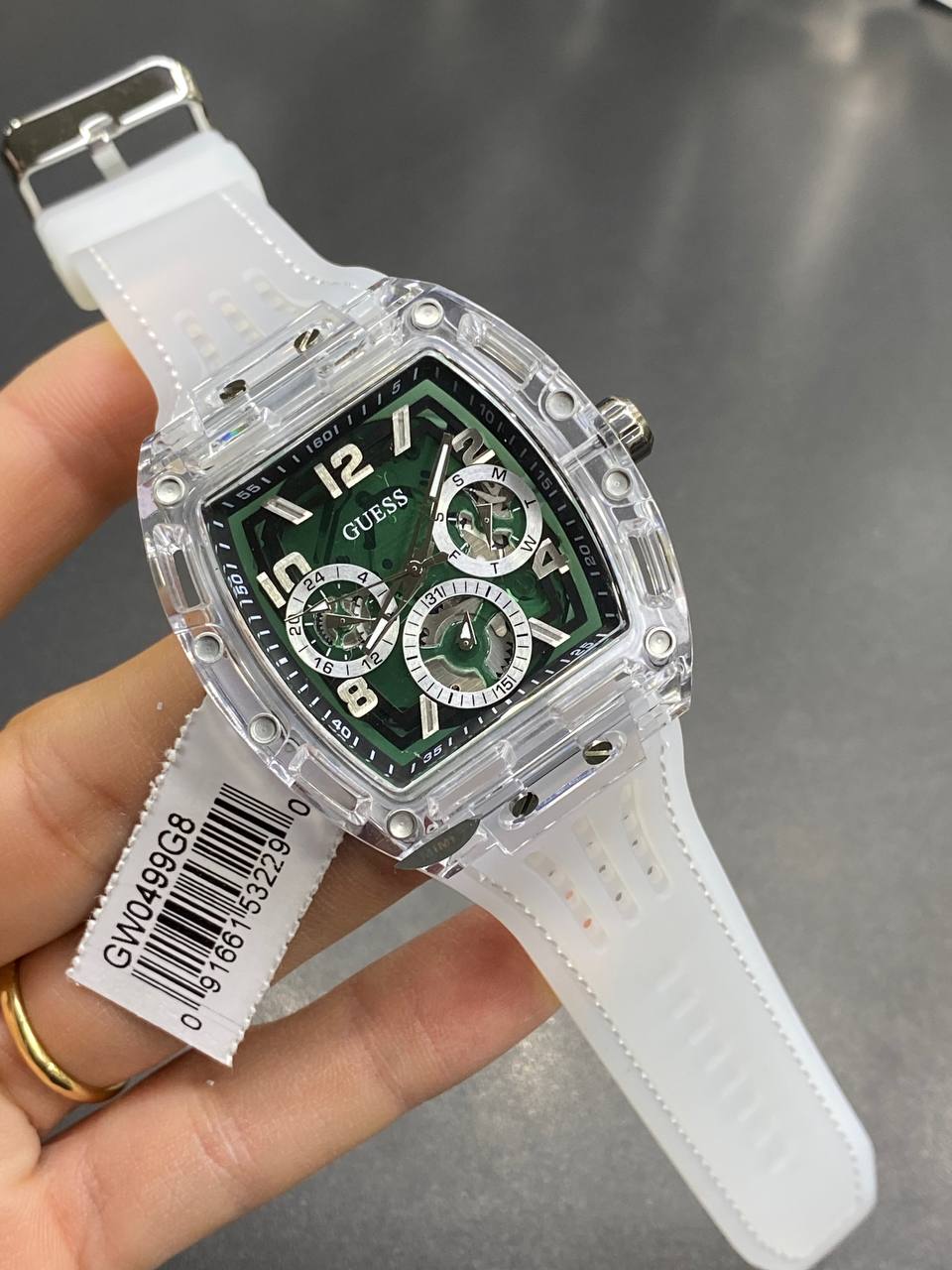 Real-life image of Guess GW0499G8 showing the vibrant green details and transparency