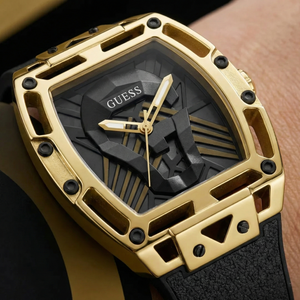 Detailed close-up of the 3D sculpted Guess triangle logo on the dial of GW0500G1