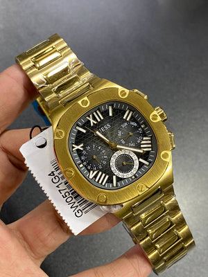 Authentic real-life photo of the Guess GW0572G2 watch showing actual gold luster and black dial texture