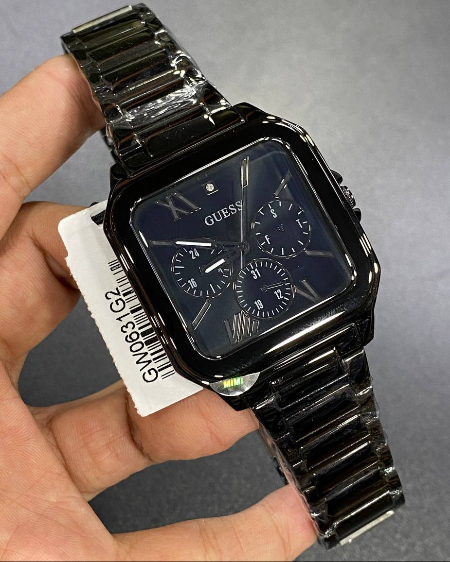 Authentic real-life photo of the Guess GW0631G2 watch showing actual black color depth and square proportions