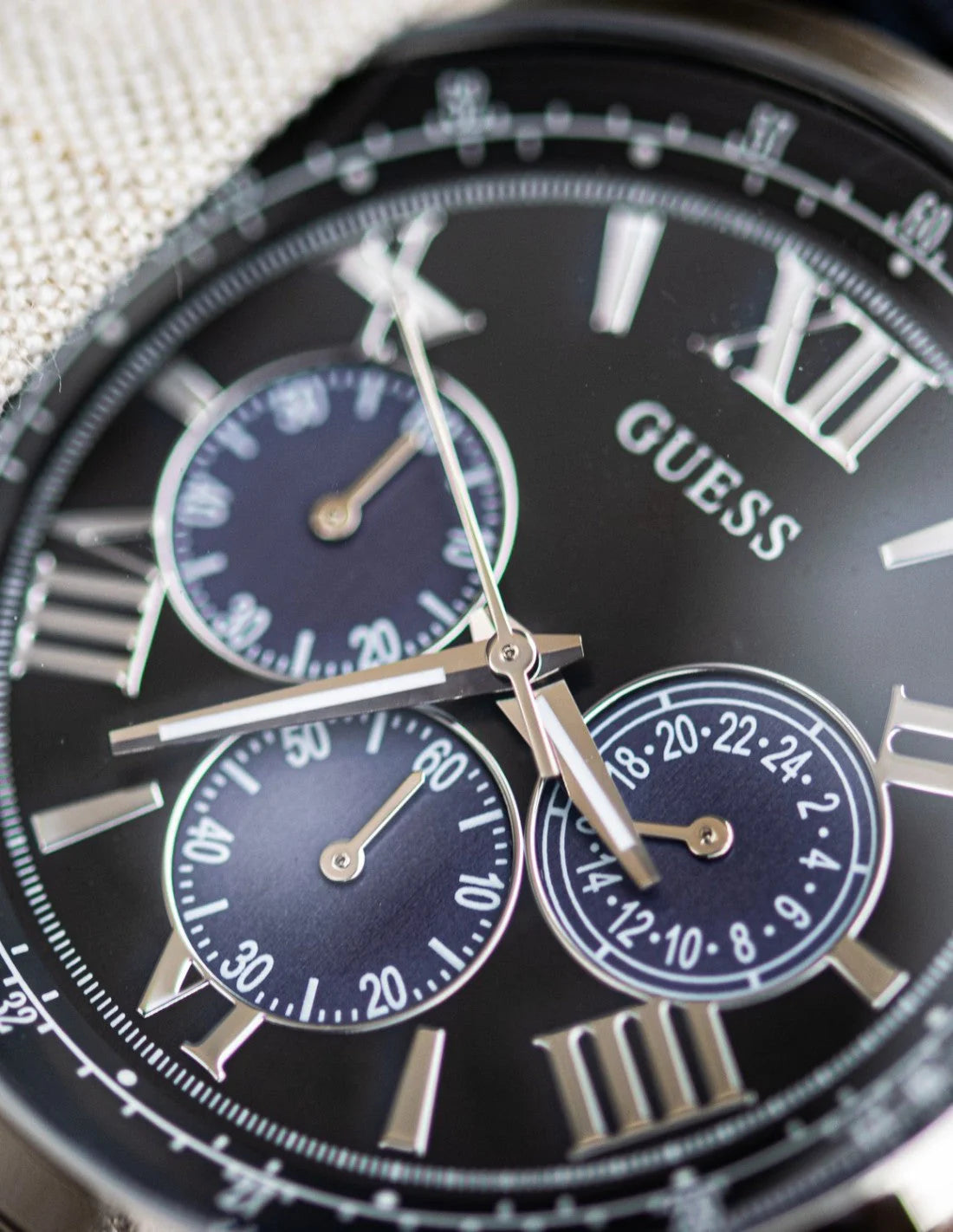 Authentic real-life photo of the Guess Horizon W0379G2 watch showing actual black plated finish