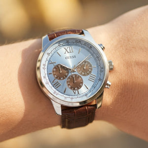Wrist shot of Guess Horizon W0380G6 watch showing the brown leather band