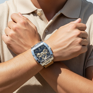 Man wearing Guess Phoenix GW0202G3 silver and brown watch with a blazer and jeans