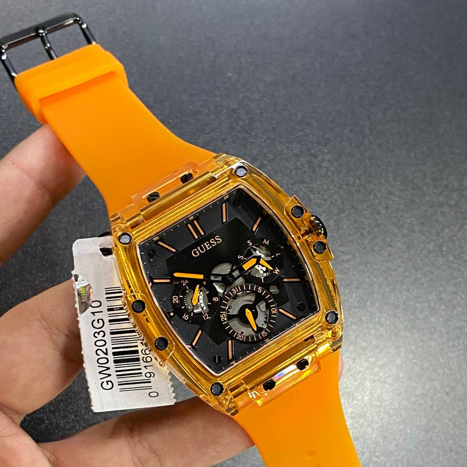 Authentic real-life photo of the Guess Phoenix GW0203G10 watch showing actual translucent orange color