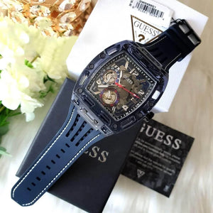 Authentic real-life photo of the Guess Phoenix GW0499G1 watch showing actual transparent blue finish and multifunction sub-dials