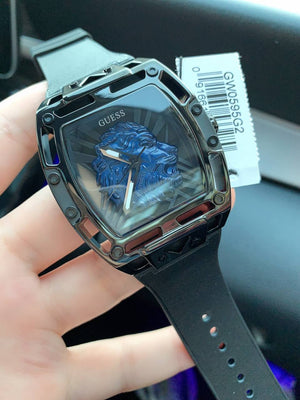 Authentic real-life photo of the Guess Phoenix Lion Head GW0595G2 watch showing actual blue lion head and matte black finish