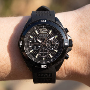 Wrist shot of Guess Surge W1168G2 watch showing the black rubber band