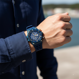 Close up shot of Guess Treasure GW0443G1 watch on wrist showing the blue skeleton dial details