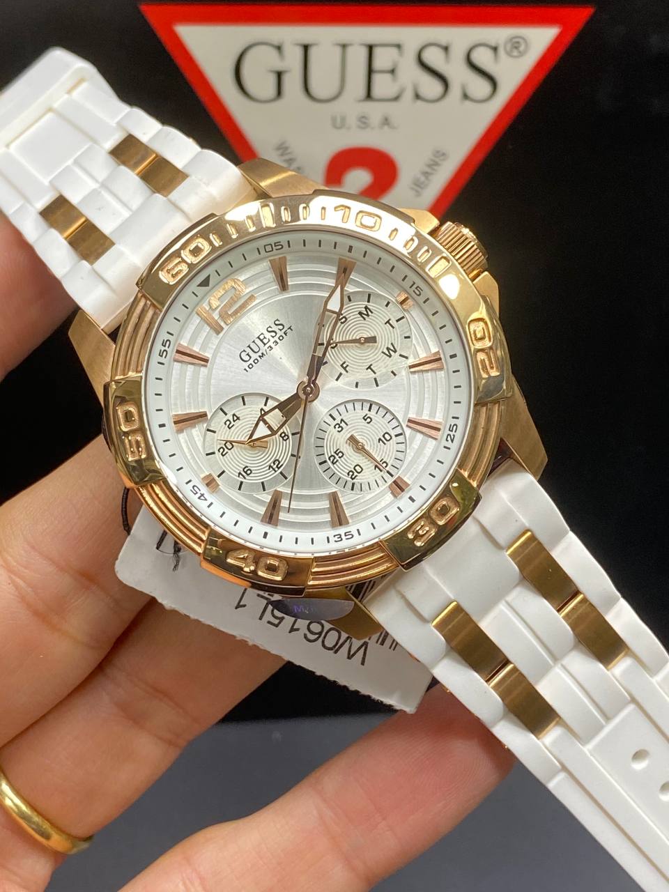 Authentic real-life photo of the Guess W0615L1 showing actual white and rose gold finish in Egypt