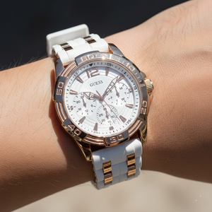 Close up shot of Guess W0615L1 on wrist highlighting the white dial and rose gold hands