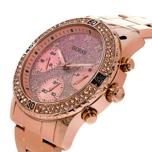 Right side profile of Guess W0774L3 highlighting the polished rose gold tone and crown