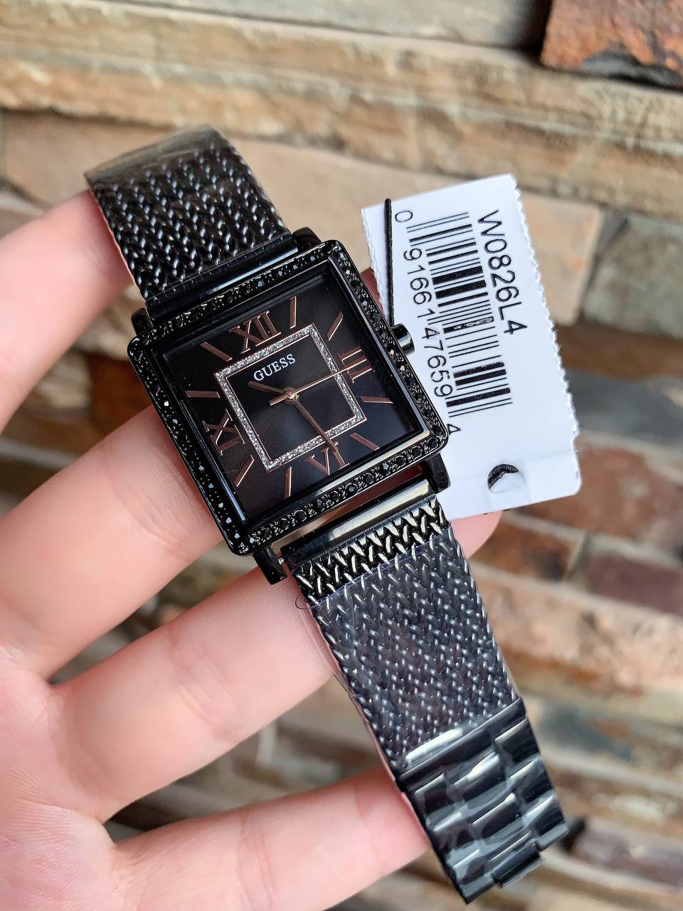 Authentic real-life photo of the Guess W0826L4 showing actual black mesh texture and crystal shine in Egypt