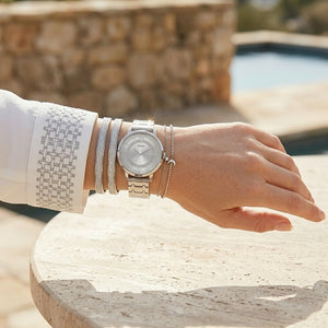 Close up shot of Guess W0933L1 on wrist showing the shimmering silver glitter dial and silver-tone hands