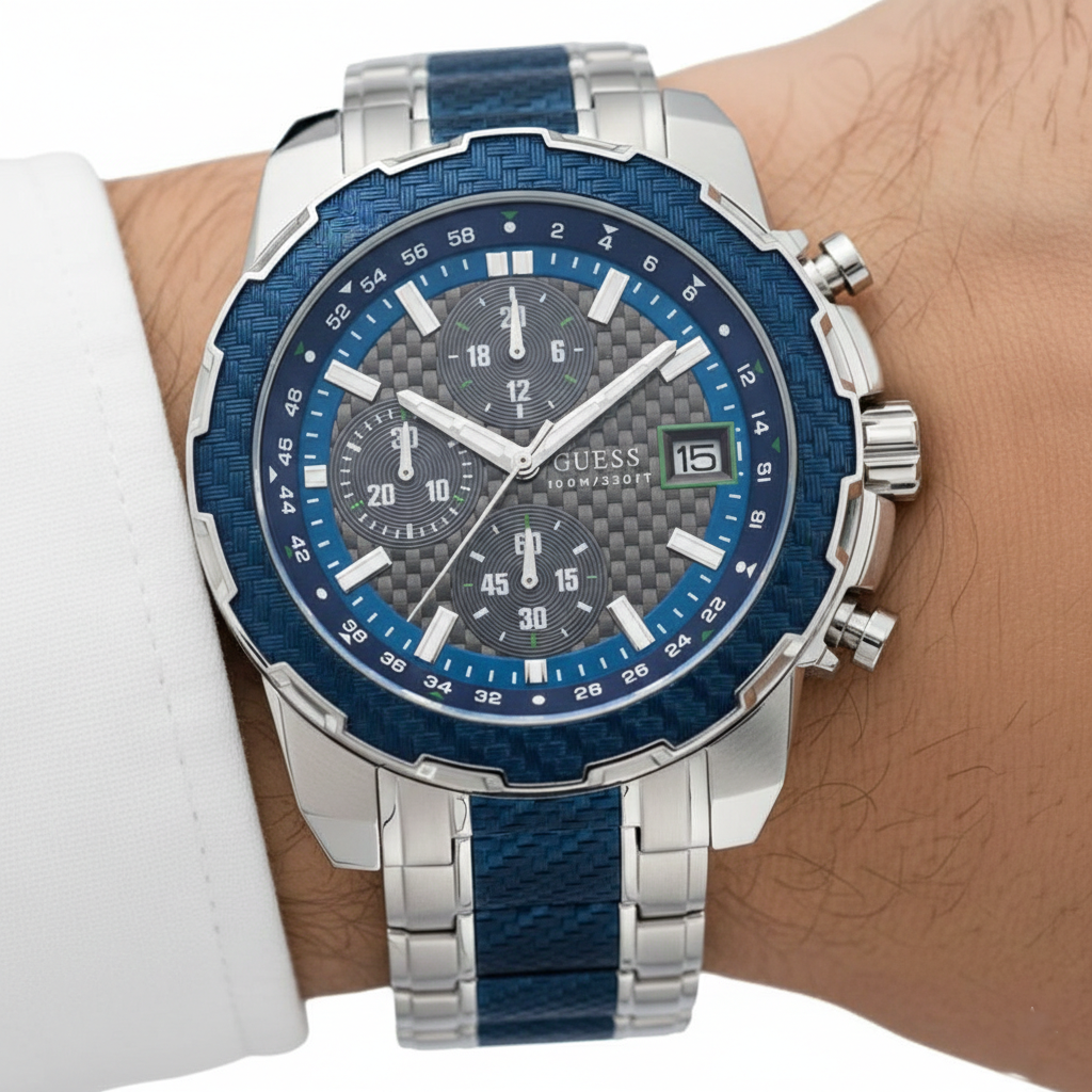 Close up shot of Guess W1046G2 on wrist highlighting the grey carbon fiber dial and blue bezel