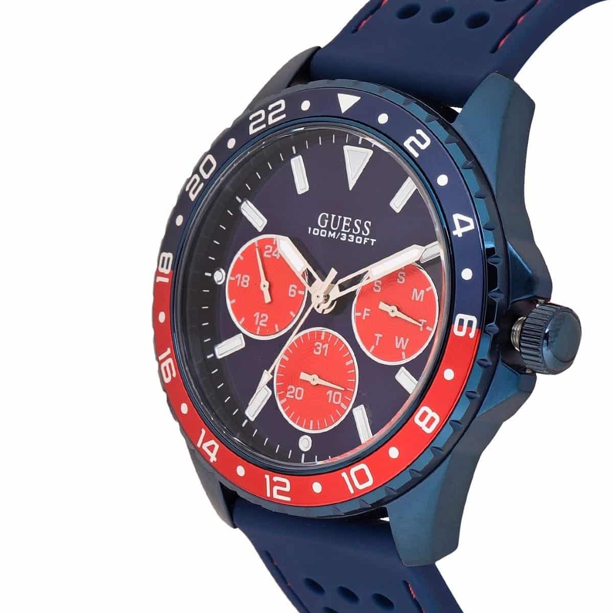 Left side perspective of the Guess W1108G1 highlighting the perforated blue rubber strap