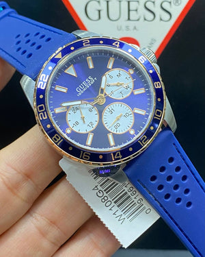 Authentic real-life photo of the Guess W1108G4 showing actual blue rubber texture and panda dial in Egypt