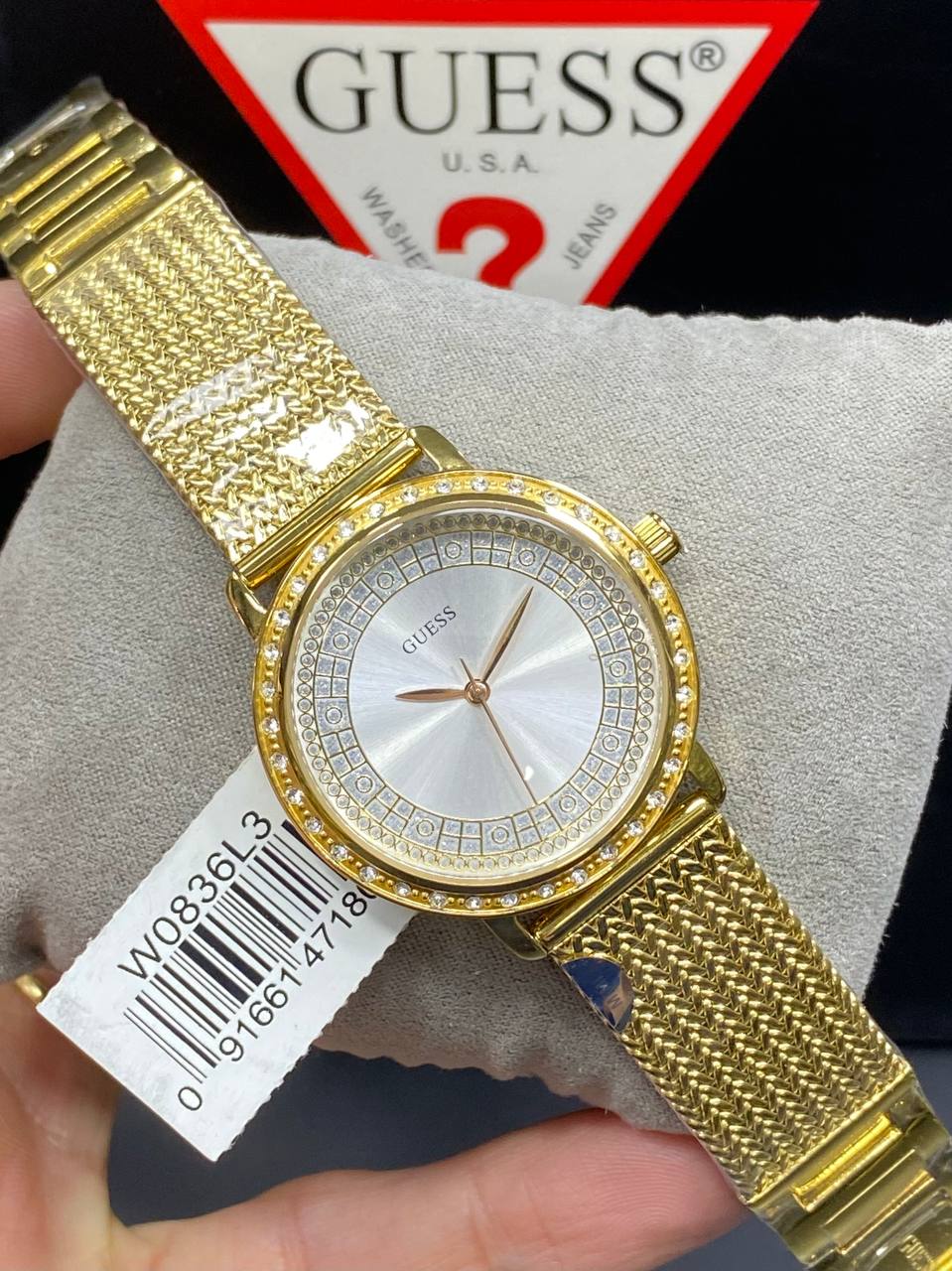 Authentic real-life photo of the Guess Willow W0836L3 watch showing actual gold mesh strap and crystal bezel