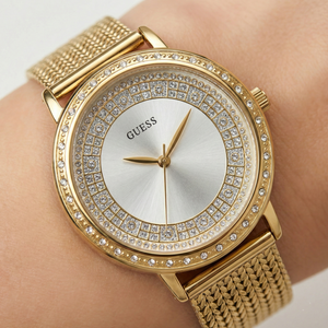 Close up shot of Guess Willow W0836L3 watch on wrist showing the elegant silver dial and crystal bezel