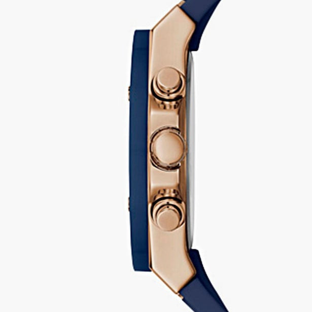 Detailed view of rose gold-tone textured crown on Guess Athena GW0030L5 women's quartz battery watch