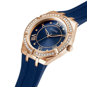 Right angled view of Guess Cosmo GW0034L4 women's quartz battery watch highlighting gold finish and crystal details