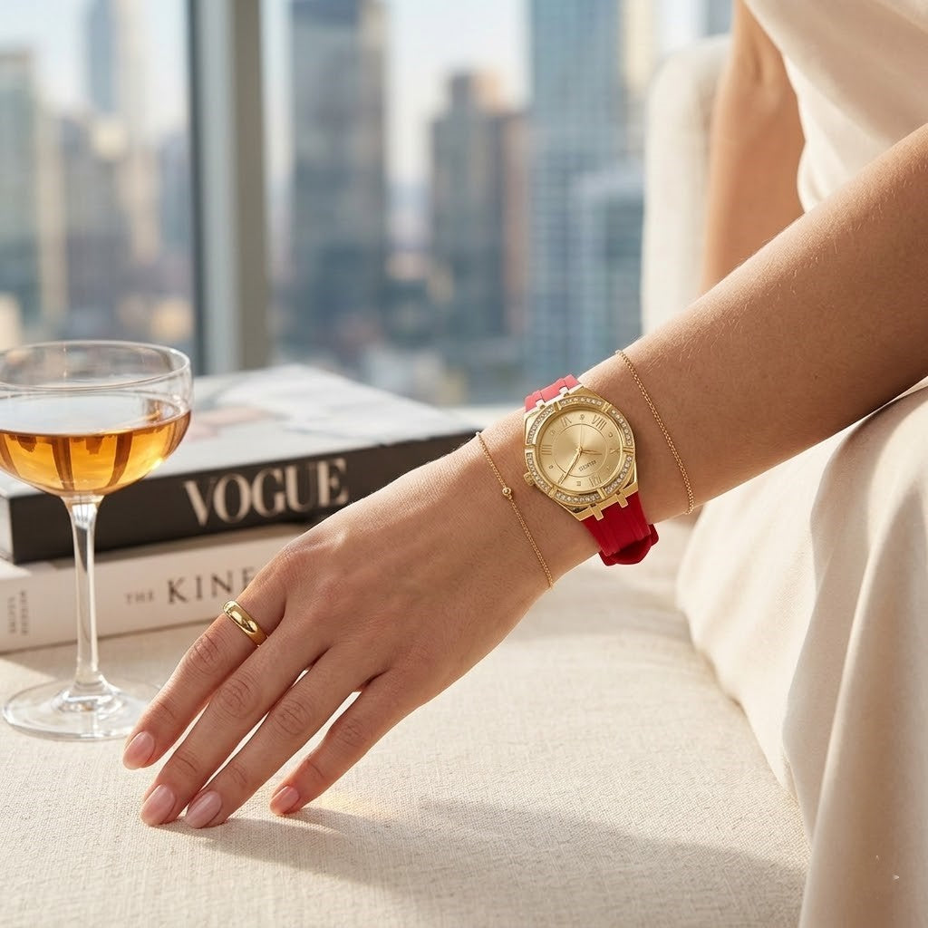 Close up of Guess Cosmo GW0034L6 women's quartz battery watch on wrist showing gold sunray dial and luxury crystal bezel