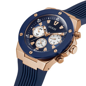 Right angled view of Guess Poseidon GW0057G2 men's quartz battery watch highlighting rose gold finish and blue bezel details