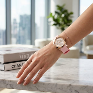 Close up of Guess Lady Frontier GW0109L2 women's quartz battery watch on wrist showing full crystal dial and luxury rose gold accents
