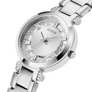 Left angled view of Guess Crystal Clear GW0470L1 women's quartz battery watch showing silver metal bracelet and sleek case profile