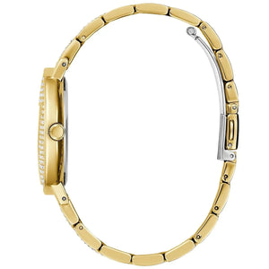 Left angled view of Guess Trend GW0512L2 women's quartz battery watch showing crystal center links on gold metal bracelet and case profile