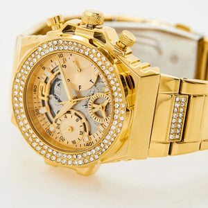 Side profile of Guess Fusion GW0552L2 women's quartz battery watch showing 10.5mm thickness and gold finish