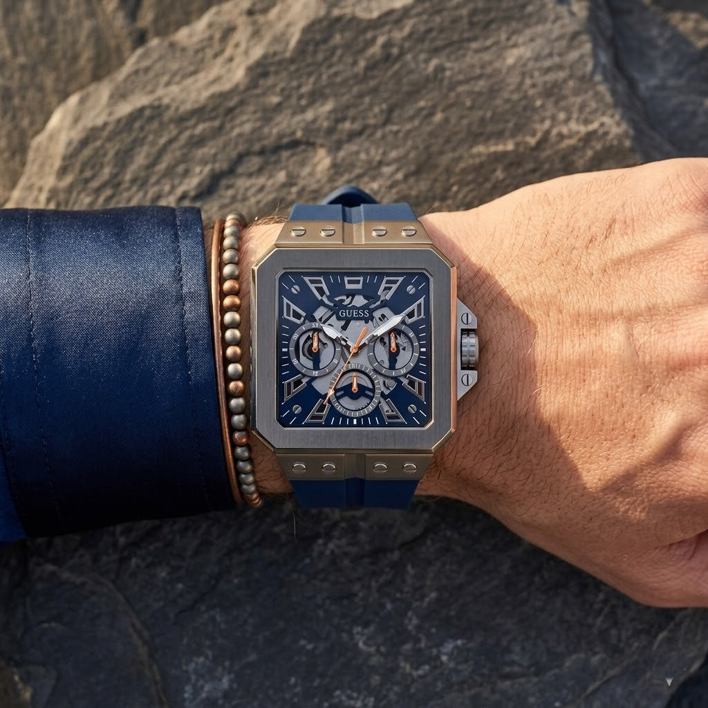 Close up of Guess LEO GW0637G1 men's quartz battery watch on wrist showing bold navy dial and luxury crystal bezel