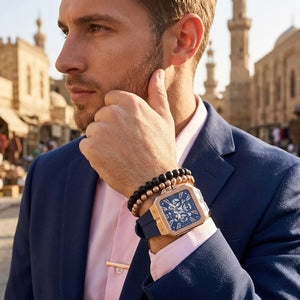 Close up of Guess LEO GW0637G3 men's quartz battery watch on wrist showing bold navy blue dial and luxury crystal bezel