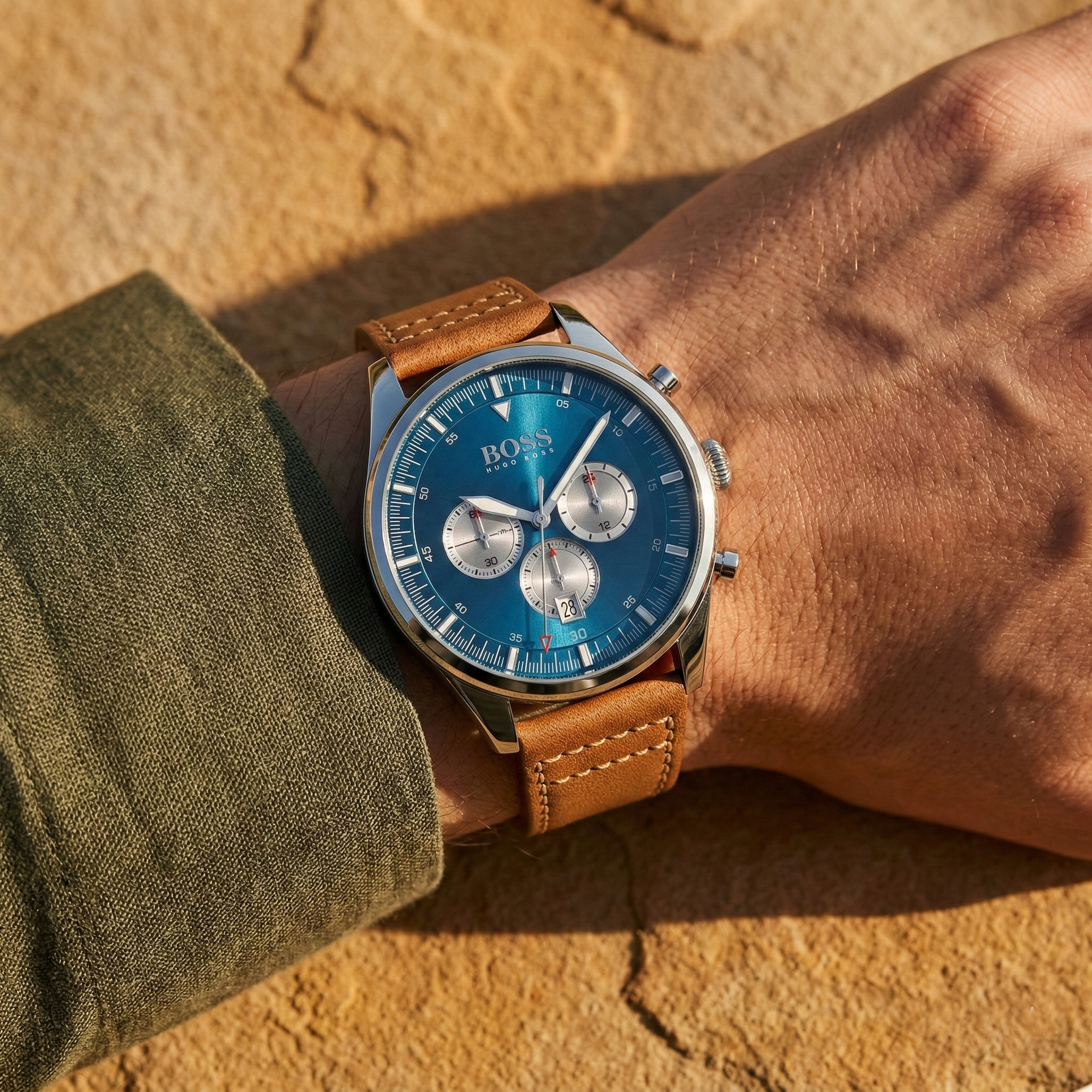 Close up shot of Hugo Boss Pioneer 1513709 on wrist showing the blue dial and vintage chronograph sub-dials