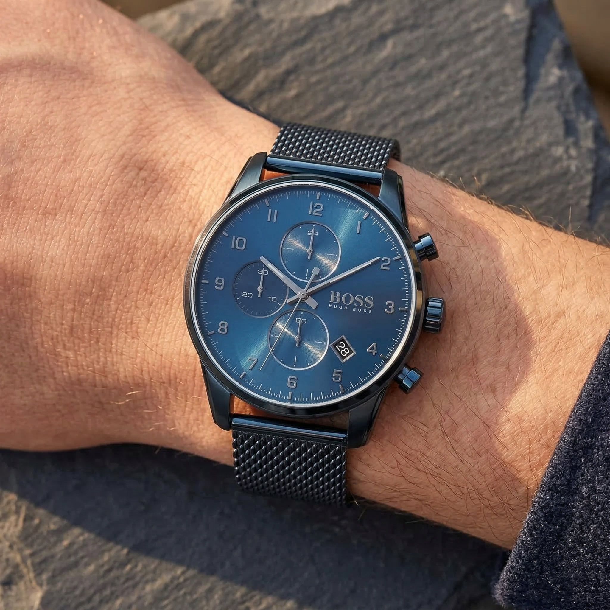 Close up shot of Hugo Boss 1513836 on wrist showing the deep navy blue dial with date window and chronograph sub-dials