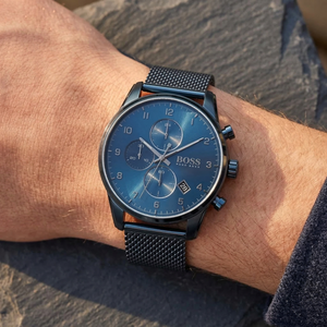Close up shot of Hugo Boss 1513836 on wrist showing the deep navy blue dial with date window and chronograph sub-dials