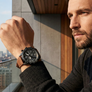 Man wearing Hugo Boss 1513851 black and brown watch for a rugged aviation-inspired and professional look