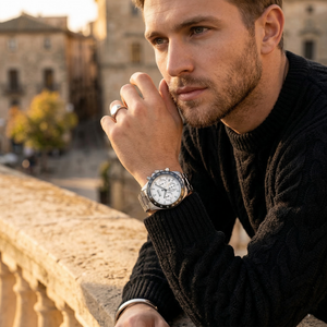Man wearing Hugo Boss Volane silver metal watch for a sharp, powerful, and luxurious professional look