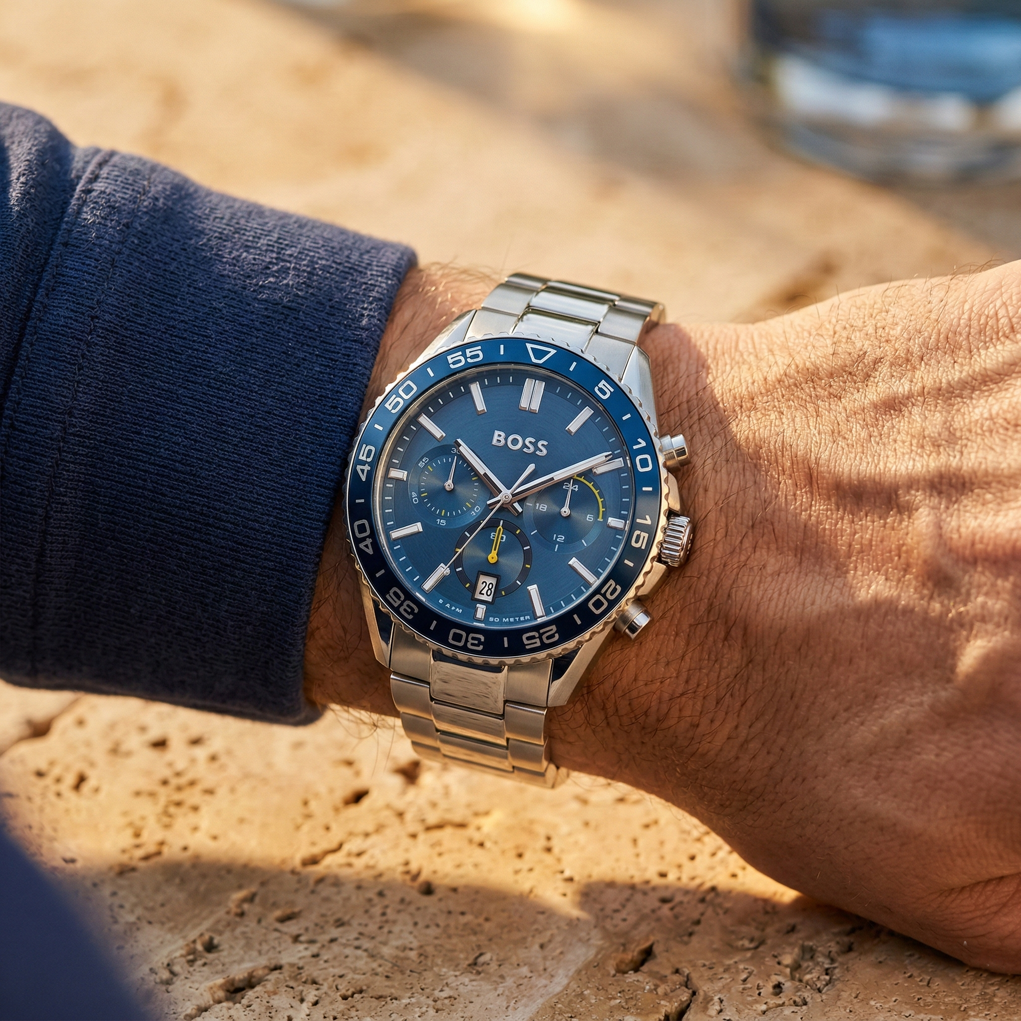 Close up shot of Hugo Boss Skymaster 1514143 on wrist showing the blue sunray dial and silver metal link details