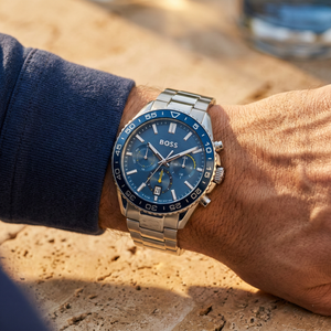 Close up shot of Hugo Boss Skymaster 1514143 on wrist showing the blue sunray dial and silver metal link details