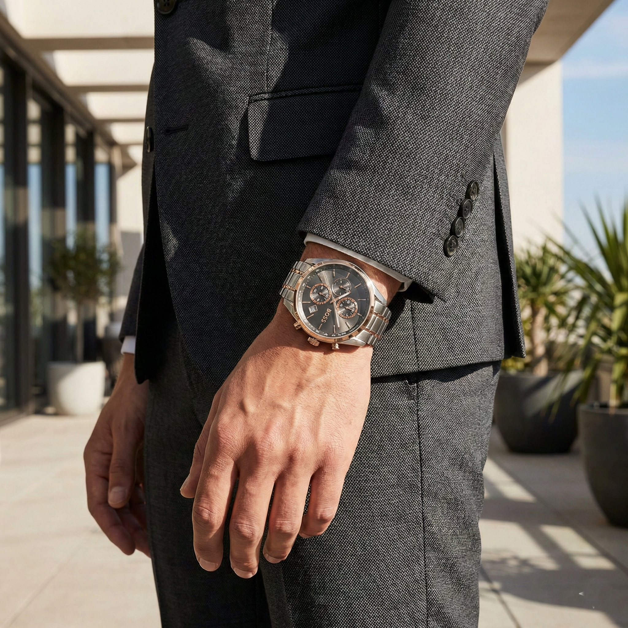 Man wearing Hugo Boss Steer two-tone watch reflecting a modern and sophisticated luxury look