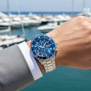Male model wearing Hugo Boss Admiral 1513907 silver watch with a sporty casual outfit